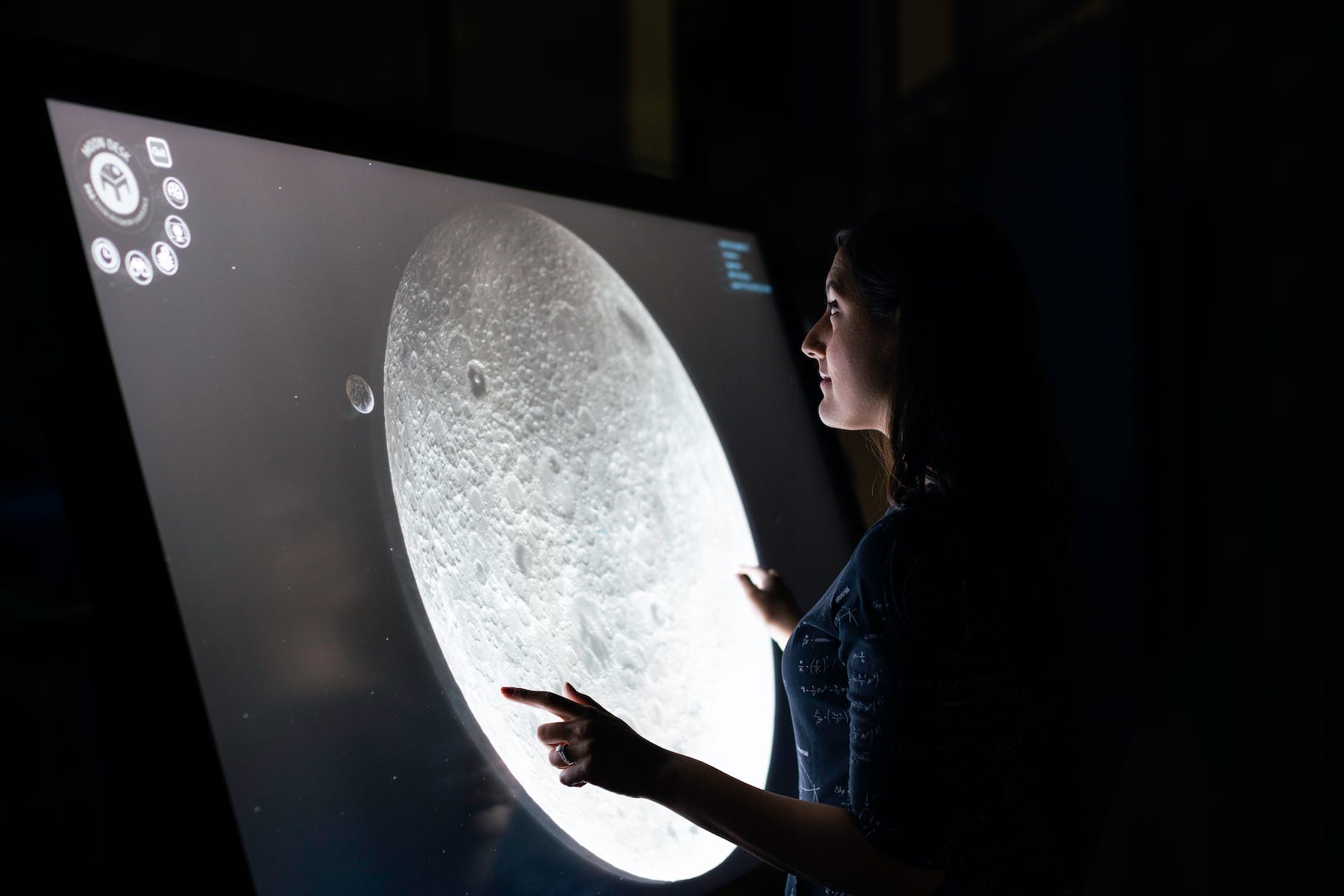 woman studying moon surface